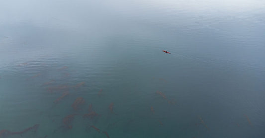 Kayak gliding on calm water