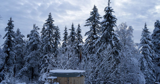 Hot tub in a snowy backyard with cover on