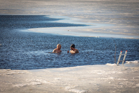Winter swimmers taking an ice bath in a frozen lake