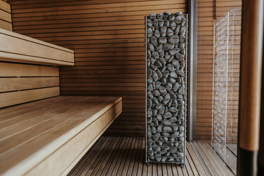 Traditional sauna room with hot stones and wooden benches
